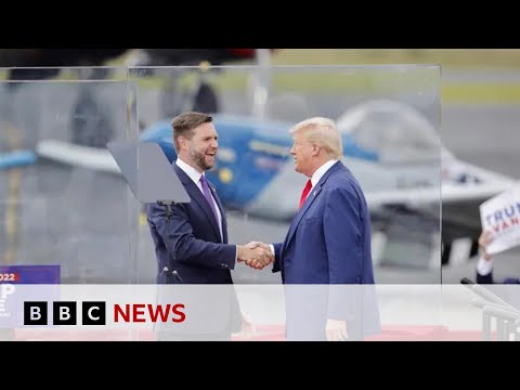 Donald Trump stands behind bullet-proof glass at first outdoor rally since he was shot | BBC News